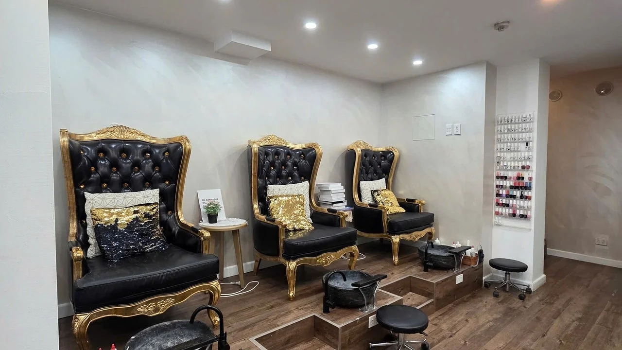 Black and gold pedicure chairs inside the OS Nails studio