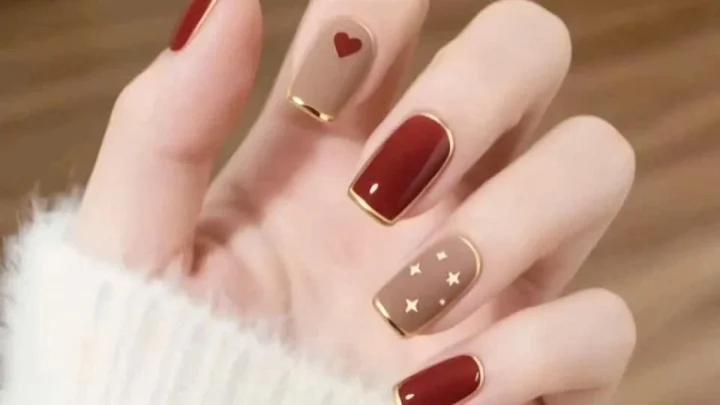 Burgundy and nude nail art with heart details from the official OS Nails gallery